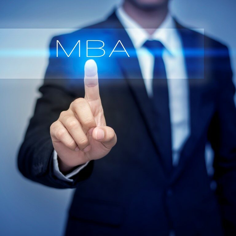 Businessman hand touching MBA button on virtual screen